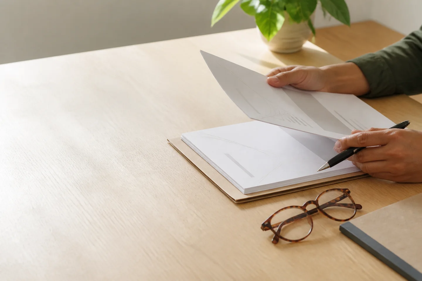 Customer reviewing a neatly organised set of service documents